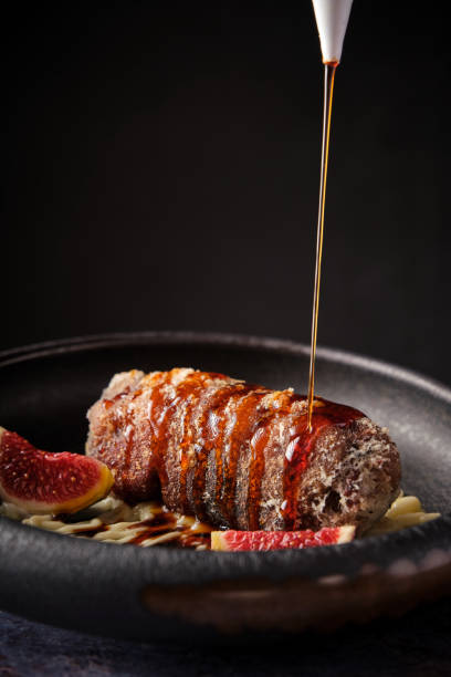 Delicious pork meat with sauce served in plate