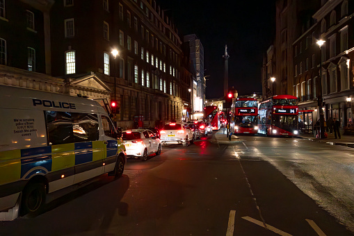 Cannon Street, London, England - October 28th 2023:  English police van driving down the street
