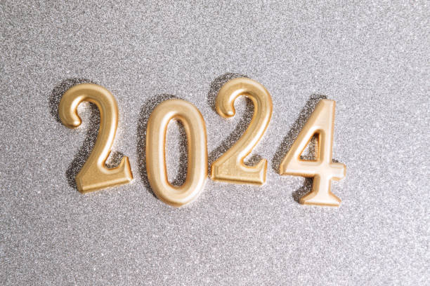 istock Background for greetings with empty space. Happy new year card. Golden figures 2024 on a silver shining sparkling background 1820161136