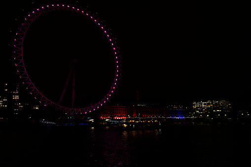 London at night. Long exposure image of the River Thames in Westminster, London, UK.