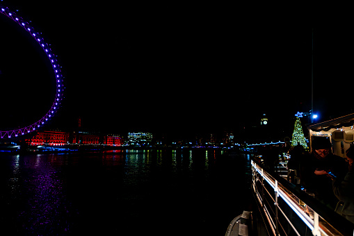 London at night. Long exposure image of the River Thames in Westminster, London, UK.
