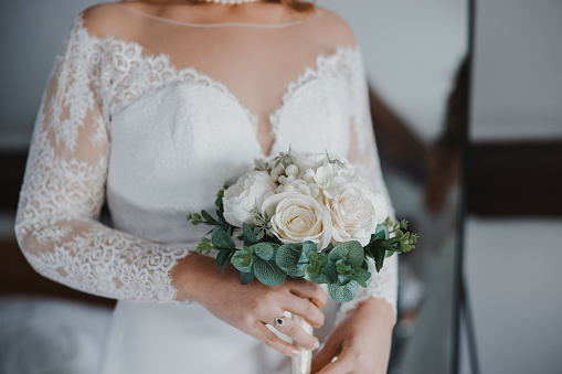 Close Up Of A Bride Holding Bouquet