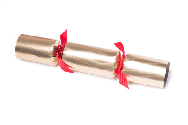 Isolated Christmas golden color cracker, holiday festive cracker on white background, holiday concept, copy space