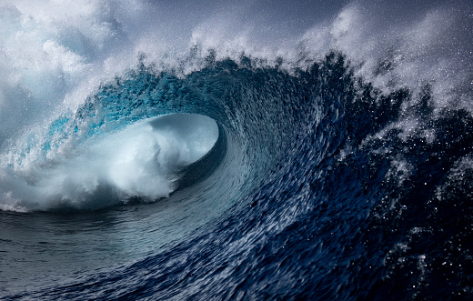 Huge wave crashing with amazing light at sunset