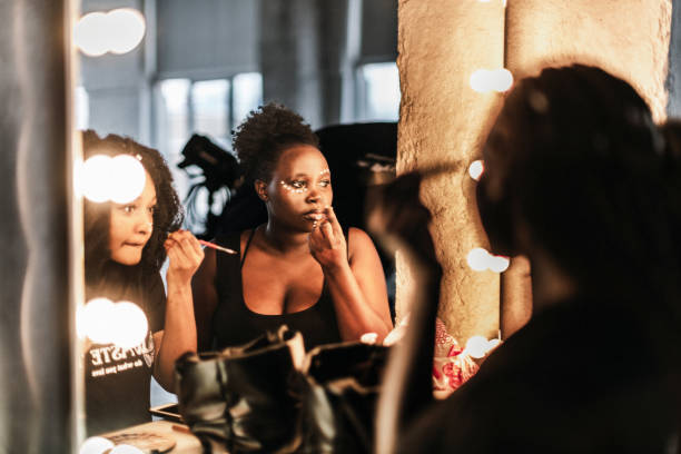 istock Black women doing a make-up near mirror 1820218232