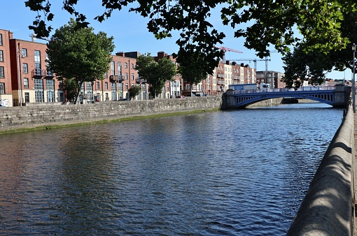 Dublin, Ireland – September 20, 2021: Glimpse of the Rory O'More Bridge over the River Liffey from Victoria Quay