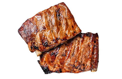 BBQ grilled pork ribs in Barbecue sauce on a grill.  Isolated, white background