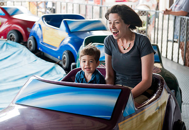 Mother and Son on Amusement Park Ride stock photo
