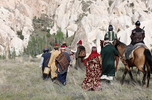 Nevşehir, Türkiye - April 24, 2016: People walking in traditional clothes. Rural life in the Cappadocia region of Turkey.