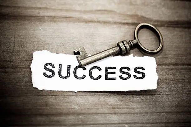 Photo of Key with success written on paper