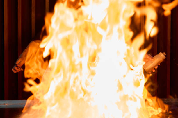 istock Chef cooking at stove with fire flame, close-up, selective focus 1820259970