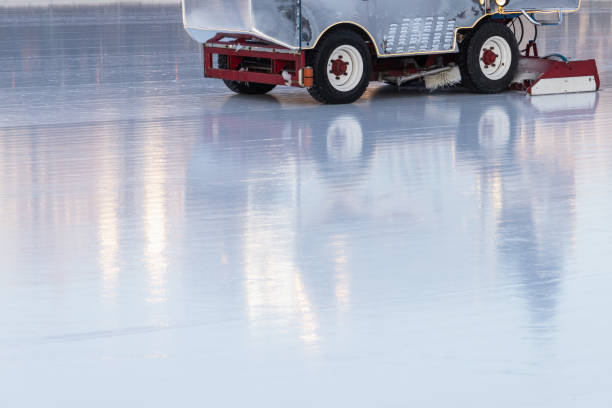 Ice rink polishing is in progress, machinery for ice renovation