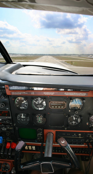 Touching down at the airport while taking a photo of the cockpit.