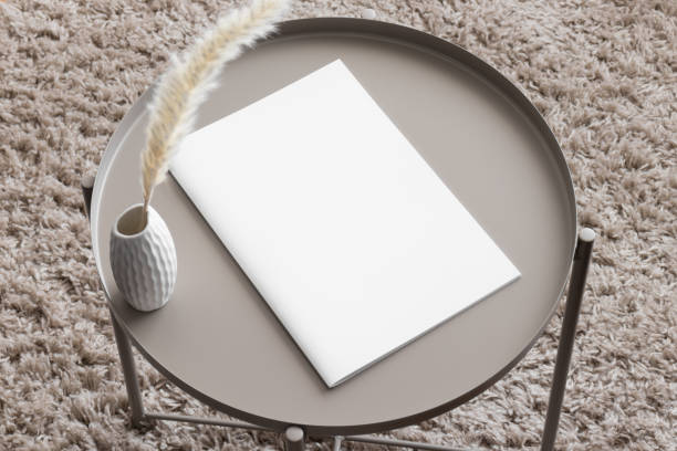 istock Magazine mockup with a pampas on the beige table. 1820267532