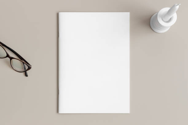 istock Magazine mockup with a candle on the beige table. 1820268060