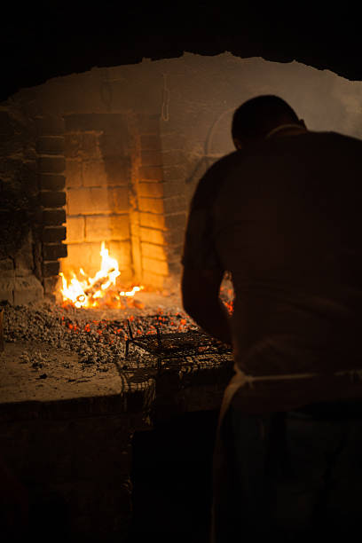 istock Man preparing food  in ancient farmhouse restaurant 182028737