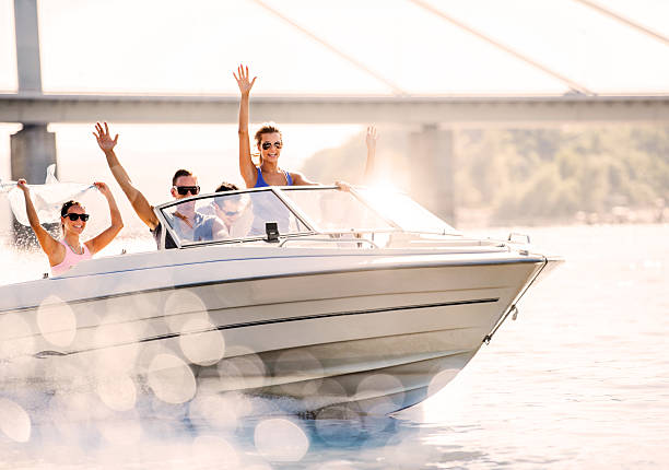 istock Cheerful young people riding in a speedboat. 182028762