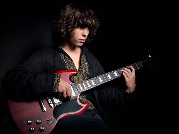 istock Teenager plays a guitar. 182028791