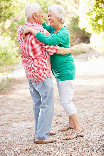 istock Senior Couple Dancing In Countryside Together 182028894