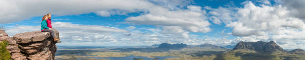 istock Young hikers looking over mountain wilderness vista 182028946