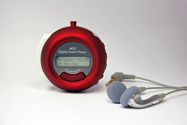 istock Modern MP3 audio player with headphones 182029472
