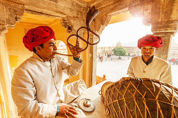 Indian Musicians Jaipur,India Indian musicians playing drums and traditional trumpet, in Amber Palace, Jaipur, India. traditional musician stock pictures, royalty-free photos & images