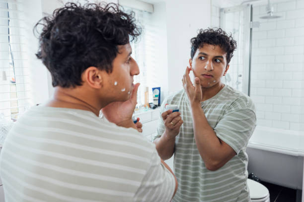 istock Applying Facial Moisturiser 1820297990