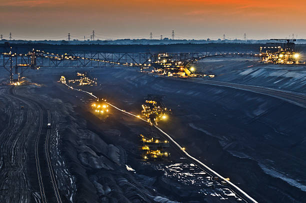 Brown coal opencast mining at night stock photo