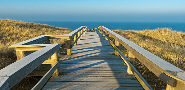 Beach path with sunset at the Baltic Sea