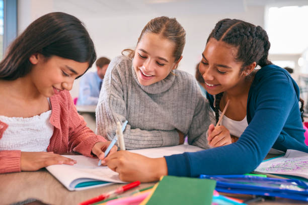 istock Three Female Secondary Or High School Students Collaborating In Study Area 1820324137