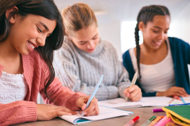 istock Three Female Secondary Or High School Students Collaborating In Study Area 1820325953