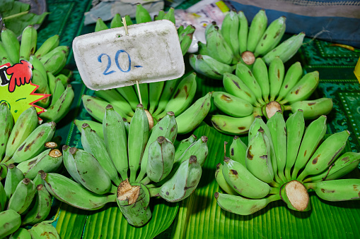 Bunch of fresh bananas at market stall