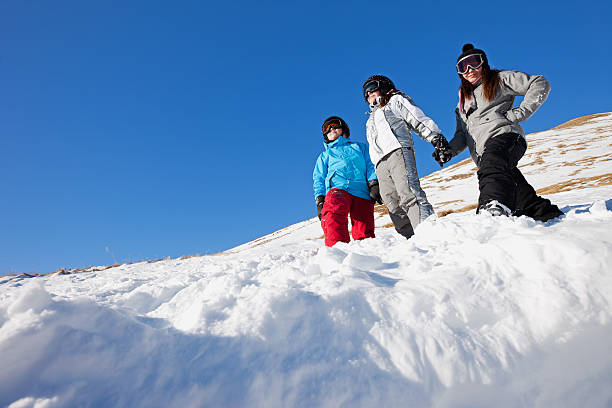 istock Happy kids playing in the snow 182032988