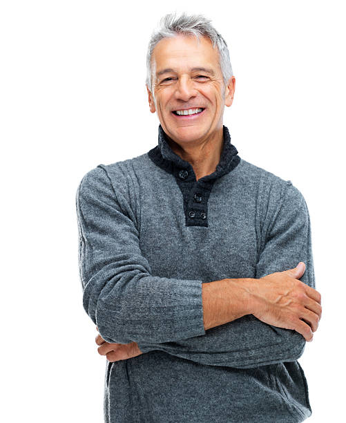 Arms crossed and radiating confidence Portrait of a smiling senior guy with arms crossed isolated on white background cardigan sweater stock pictures, royalty-free photos & images