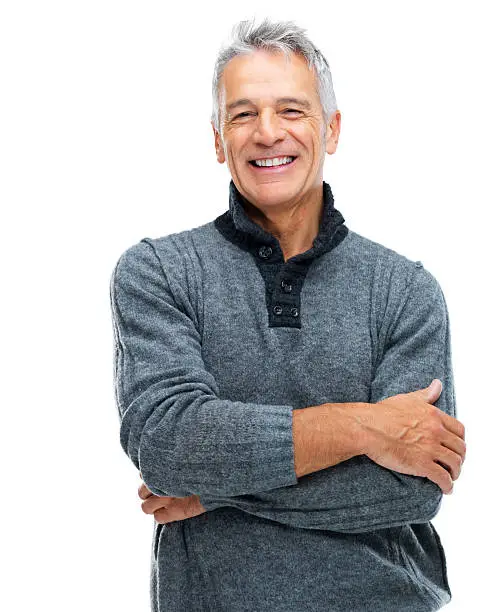 Portrait of a smiling senior guy with arms crossed isolated on white background