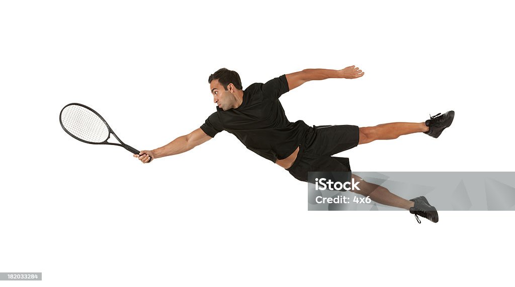 Man in action playing tennis Jumping Stock Photo