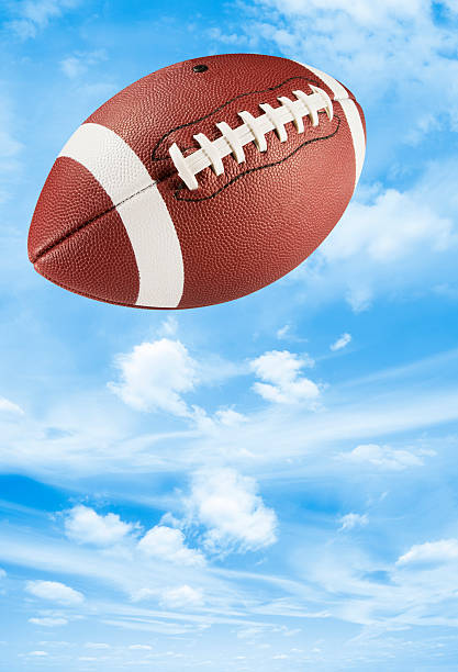 Brown Leather American Football Midair In Blue Sky Stock Photo - Download  Image Now - American Football - Sport, American Football - Ball, Mid-Air -  iStock