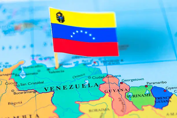 Map and flag of Venezuela. Source: World reference atlas