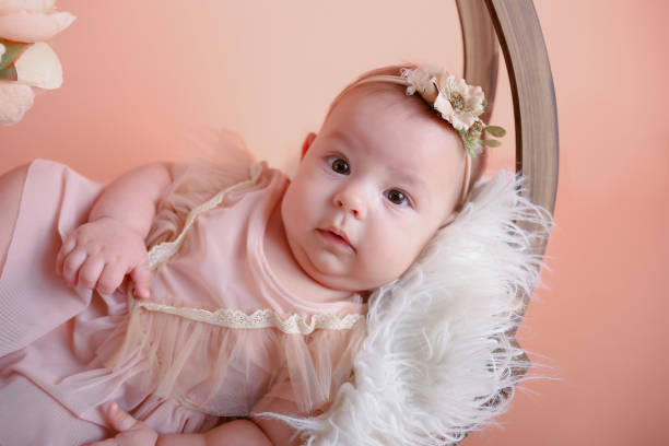 istock baby girl posing and smiling 1820337533