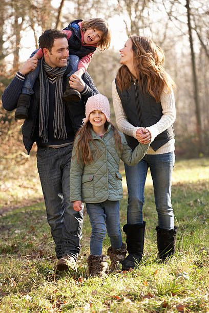 istock Family with two young daughters outdoors in winter 182033962