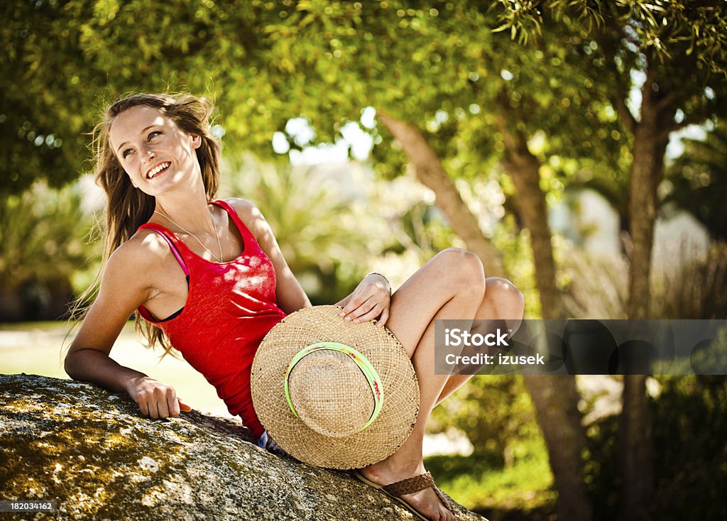Relaxing in the park Happy beautiful girl relaxing in the park in the summer. 18-19 Years Stock Photo