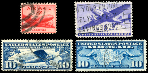 Four old US Air Mail Stamps.
