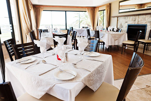 istock Restaurant interior with tables set for a meal 182035412