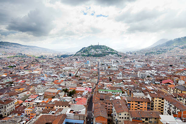 Aerial view of the city Quito in Ecuador "A view of Quito, Ecuador.  You can see the Virgin de El Panecillo in the distance." quito photos stock pictures, royalty-free photos & images