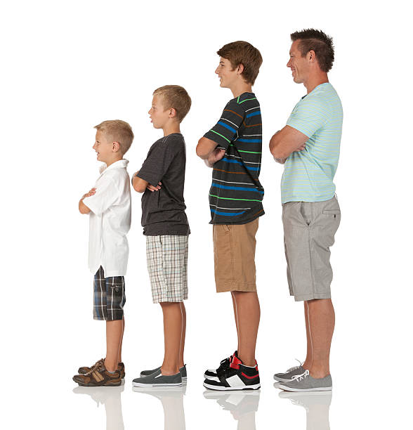 istock Man and his children standing in ascending order 182035636