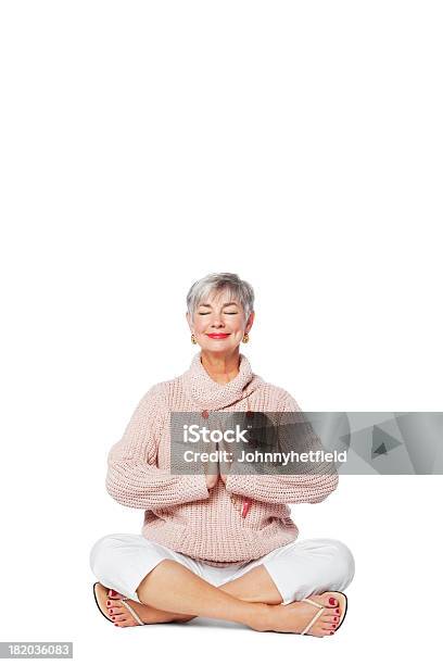 Senior Woman Meditating On Floor Stock Photo - Download Image Now - Senior Adult, Yoga, White Background