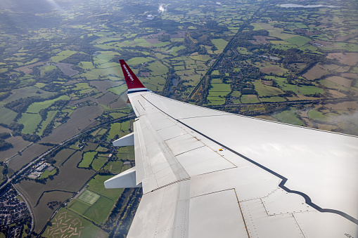 England - October 24th 2023: Winglet of a Boeing 737 Max 8 from the Norwegian airline over the south of England preparing to land in Gatwick
