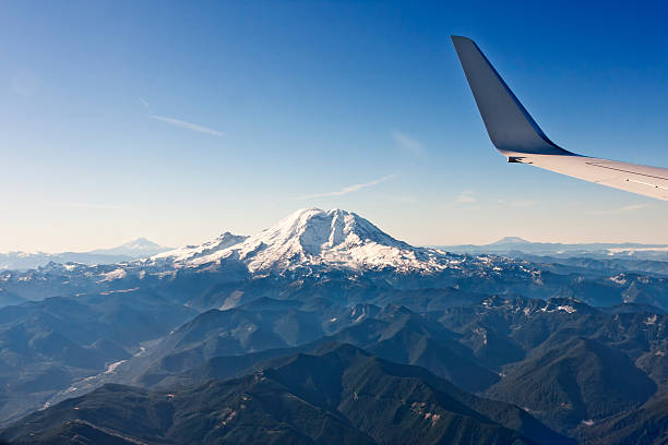 istock Airplane Wing Crossing over the Mountains 182036122