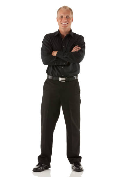 Businessman standing with his arms crossed stock photo