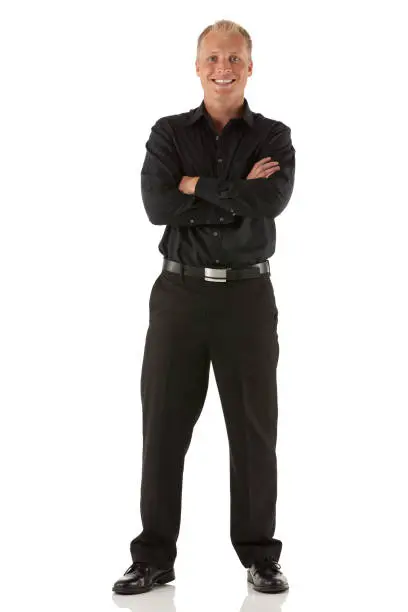 Businessman standing with his arms crossed